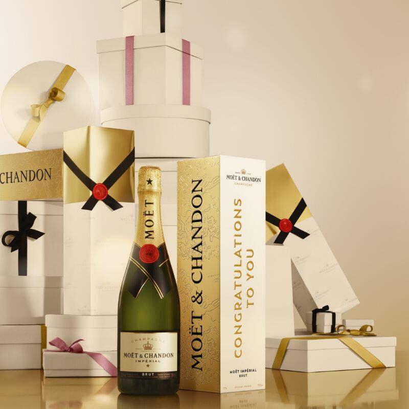 A bottle of Moet Champagne with gift boxes - perfect for a wedding or engagement gift!