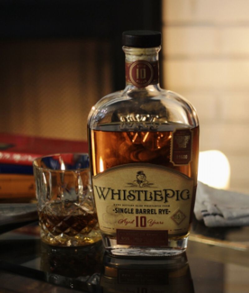 Bottle of WhistlePig 10YO Single Barrel Rye S1B51 with a glass 
