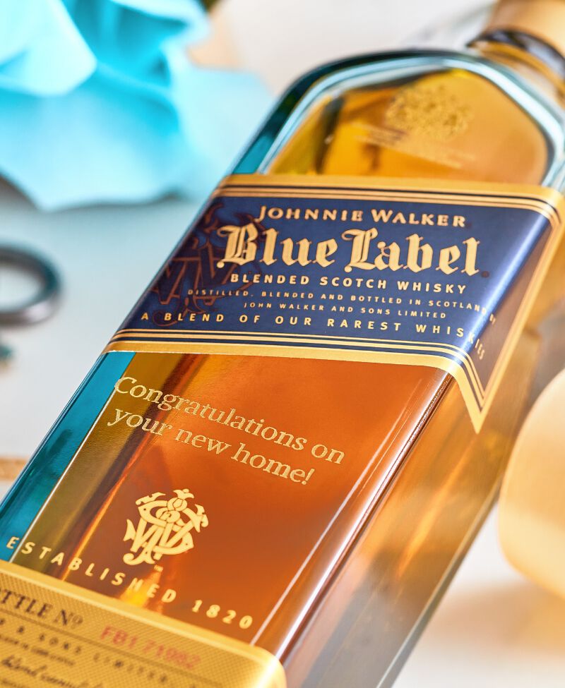 Bottle of Johnnie Walker Blu Label engraved with "Congratulations on your new home""