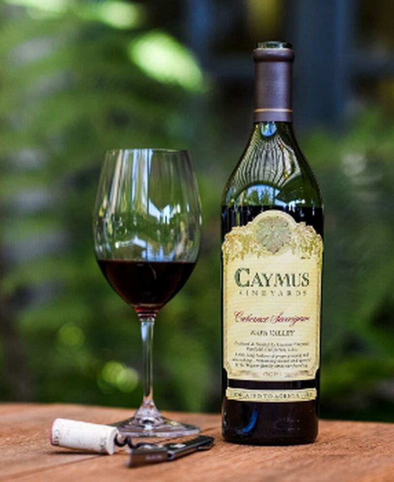 Bottle of Caymus Napa Valley Cabernet Sauvignon with a wine glass